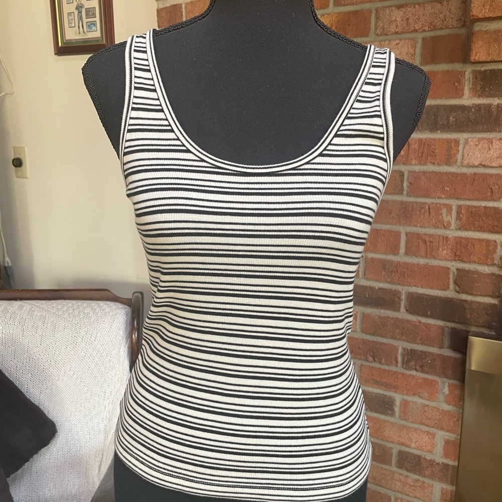 Express black and cream striped tank in excellent condition. Rayon and Spandex